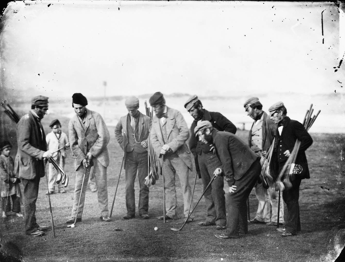 Legendary golfers including Old Tom Morris and Allan Robertson play golf